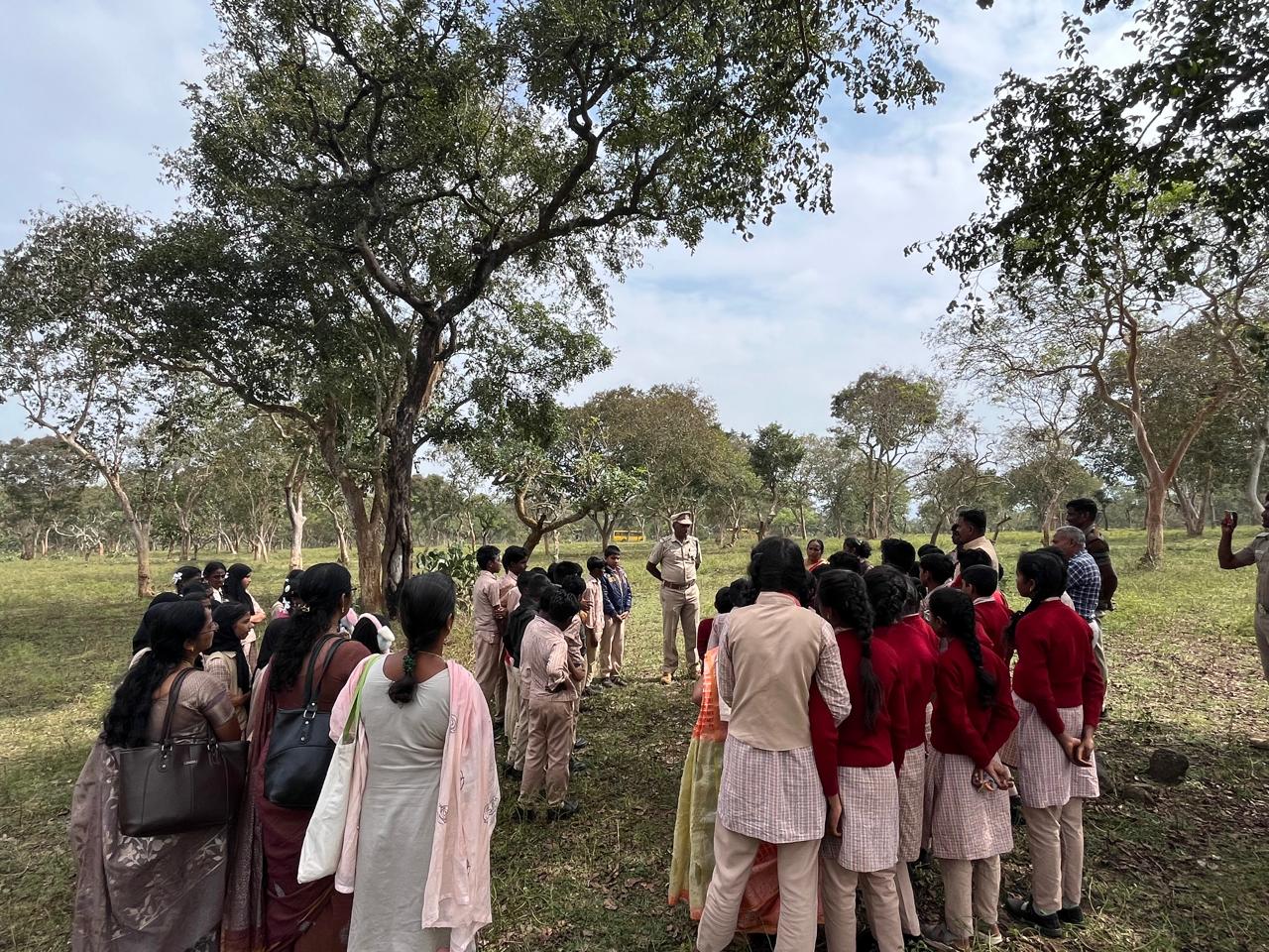 Interacting with a forest ranger at Vibuthi Malai